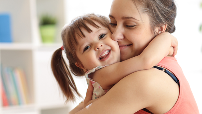 image of a parent-carer and child hugging
