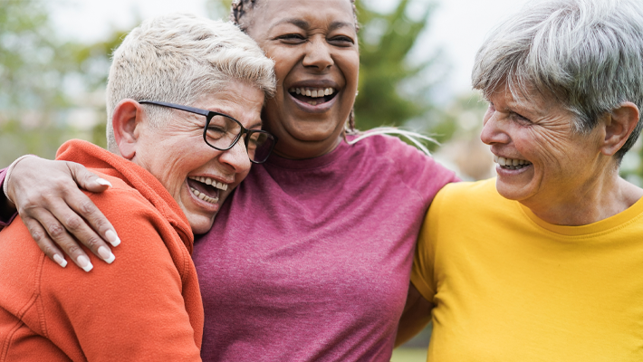image of three mature woman having a laugh