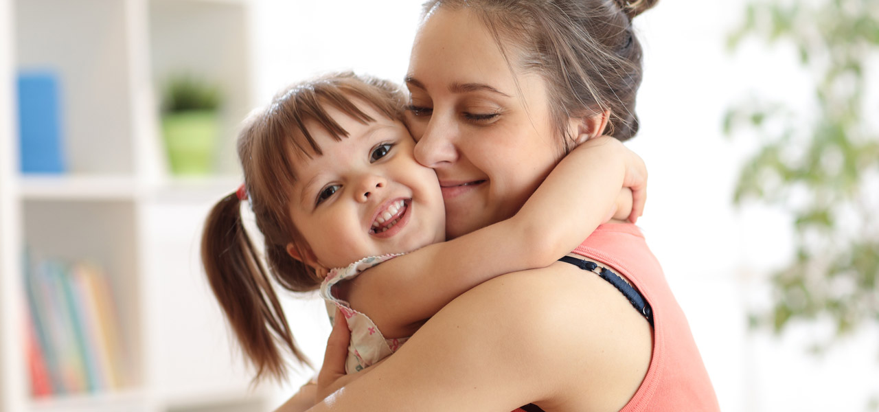 image of a parent or carer holding a child